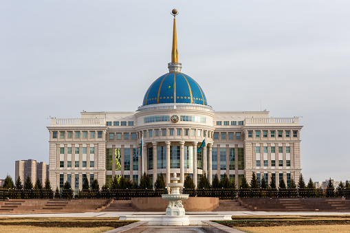 Nur Sultan (Astana), Kazakhstan, 11.11.21. Ak Orda Presidential Palace building with blue dome and gold spire.