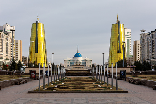 Nur Sultan (Astana), Kazakhstan, 11.11.21. Ak Orda Presidential Palace building with two Golden Towers seen from The Nurjol Boulevard.