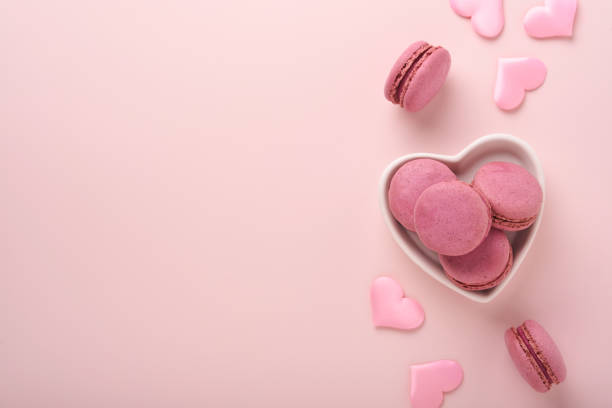 istock Valentines Day card. Pink empty envelope and macaron macaroon cookie on pink background. 8 March, Womens Mothers Valentines Day, Birthday. Flat lay, top view, copy space. 1363571771