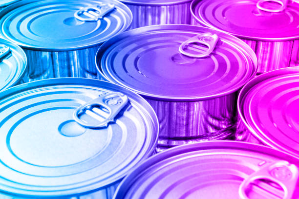 Close up photo of aluminium cans background with opener. Aluminium cans black and white. Aluminium beverage cans top view. Drink can. Metal containers for packaging drinks. stock photo