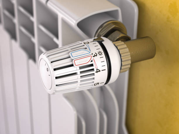 istock Thermostatic radiator valve close up. Temperature control and consumption saving 1363573352
