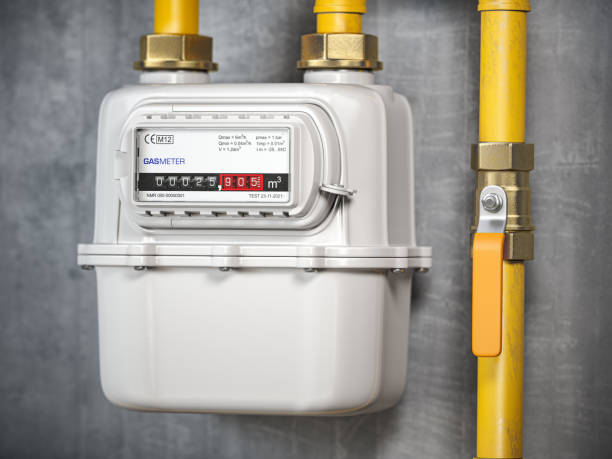 Natural gas meter with tubes on the wall. stock photo