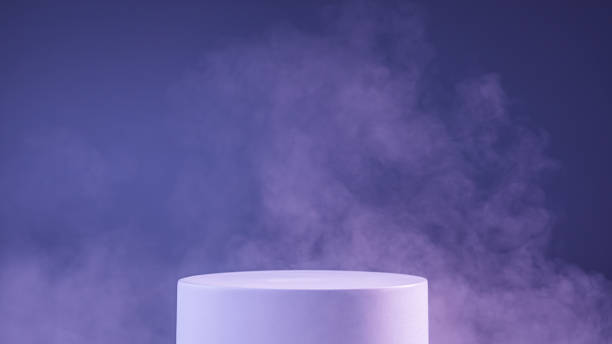 White cylinder podium with smoke in the periwinkle blue color of 2022 stock photo