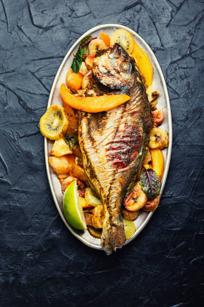 istock Baked gilthead fish in fruit. 1363578359