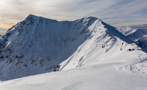 istock Mountain peaks in a beautiful snowy winter scenery. 1363579429