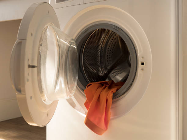 Orange T-Shirt coming out from washing machine
