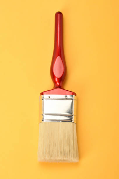 istock Paintbrush on the yellow background 1363580964