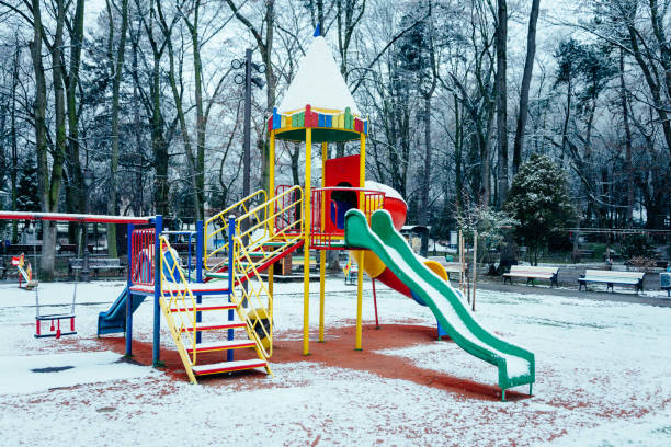 istock Deserted children's playground in the snow 1363581764