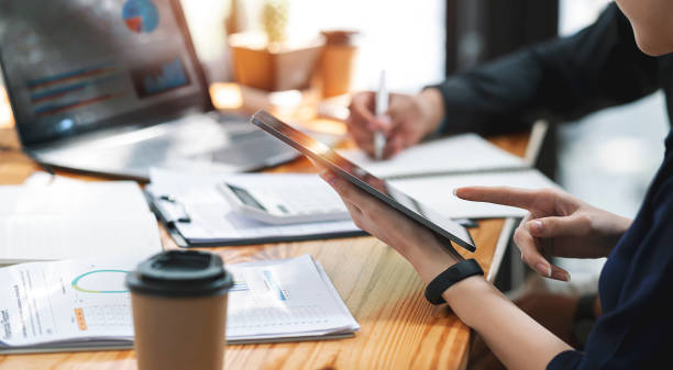 istock Businesspeople working at office with tablet and document on his desk, doing planning analyzing the financial report, business plan investment, finance analysis concept. Economic business discussions. 1363581852