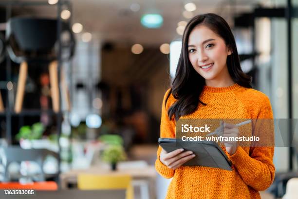 Smart Confidence Asian Female Startup Entrepreneur Small Business Owner Businesswoman Wear Smart Casual Cloth Smile Hand Use Tablet Woking Inventory Checking In Showroom Office Daytime Background Stock Photo - Download Image Now