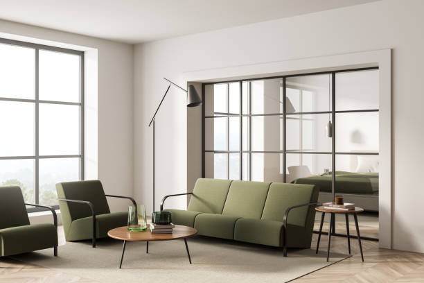 istock Bright living room interior with two armchairs, sofa, panoramic window 1363584006