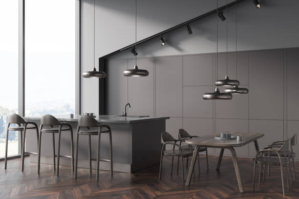 istock Dark kitchen interior with dining table and seats, dishes and window 1363584189