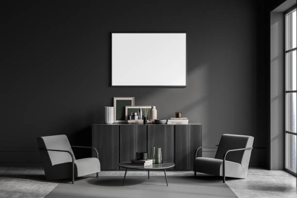 istock Dark guest room interior with two armchairs, window and mockup poster 1363584231