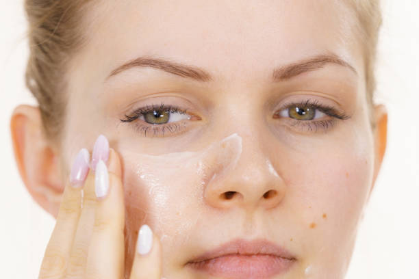 istock Girl apply cream cosmetic 1363585208