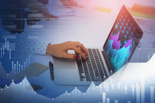 istock Two businesswomen at workplace inside an office analyzing forex chart 1363586110