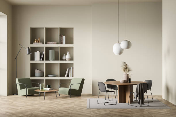 istock Light guest room interior with seats and bookshelf, table and chairs on carpet 1363587627