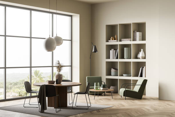 istock Light guest room interior with seats and shelf, table with chairs and window 1363587786