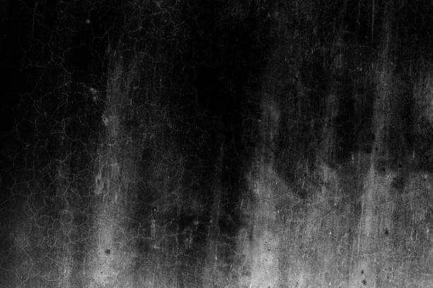 istock Abandoned dark cement plaster wall with cracks and grunge texture for background 1363587924