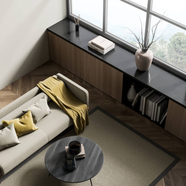 istock Minimalist relaxing room interior with sofa and coffee table near window, top view 1363587946