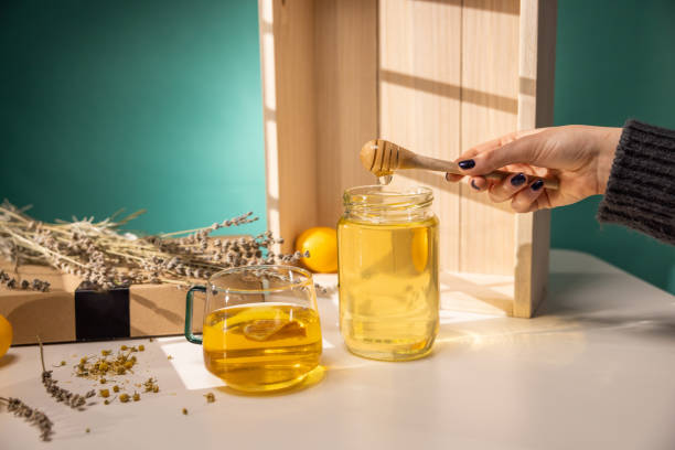 Honey dripping and glass cup of tea