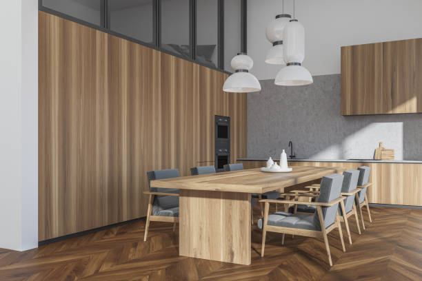 istock Bright kitchen room interior with dining table, six armchairs, bed 1363588248