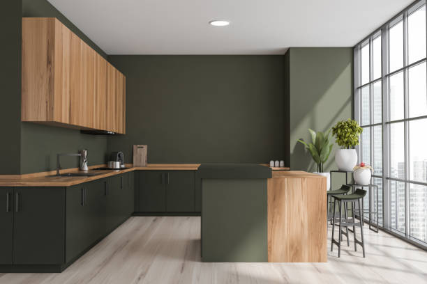 istock Green kitchen interior with table and bar chairs on parquet floor near window 1363588853