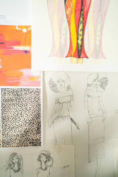 istock Dress design sketches hanging on wall in workshop 1363590121