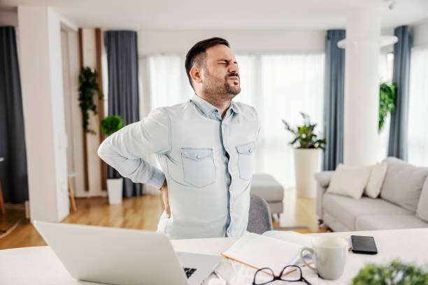 istock A freelancer having back pain from sitting and working from home. 1363590373