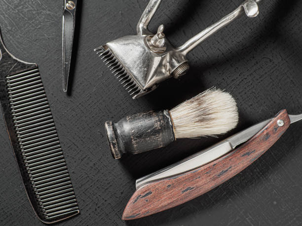 istock vintage barber tools dangerous razor hairdressing scissors old manual clipper comb shaving brush. on a black 1363590648