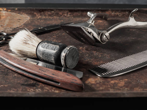 istock vintage barber tools dangerous razor hairdressing scissors old manual clipper comb shaving brush. 1363590689