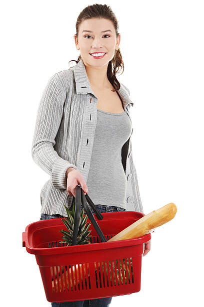 istock Young woman with shopping basket 136359151