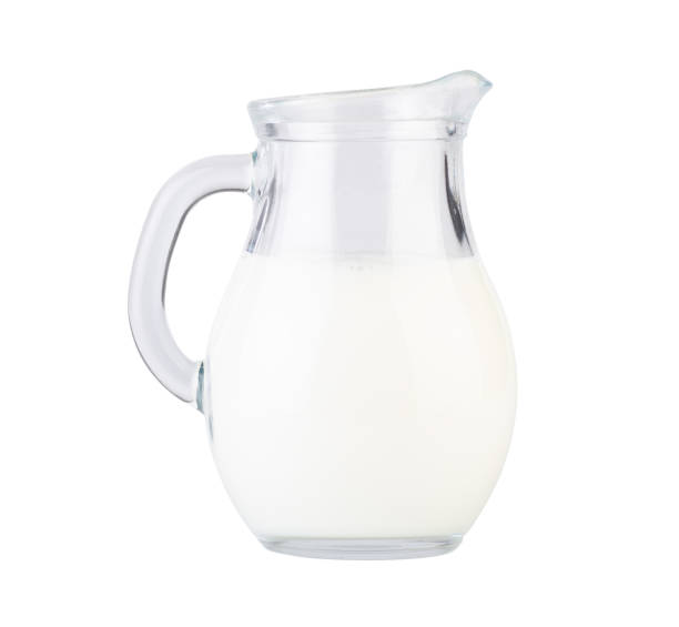istock Cow's milk in a beautiful jug isolated on white background 1363593074