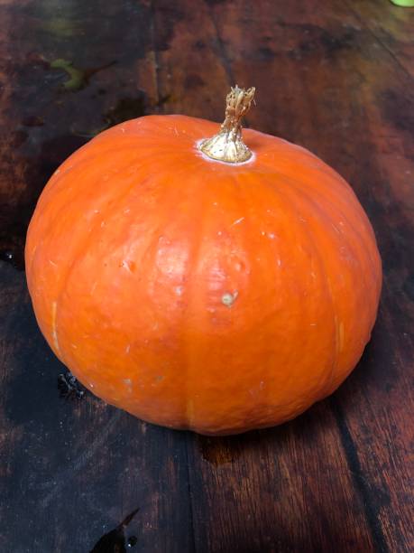 istock Small pumpkins in the brown table 1363594160
