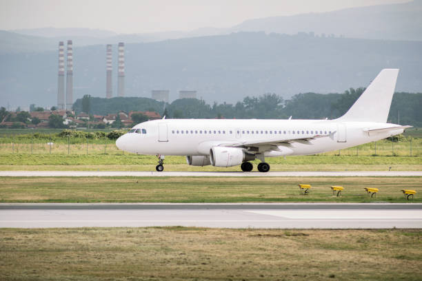 istock White plane on taxiway 1363594230