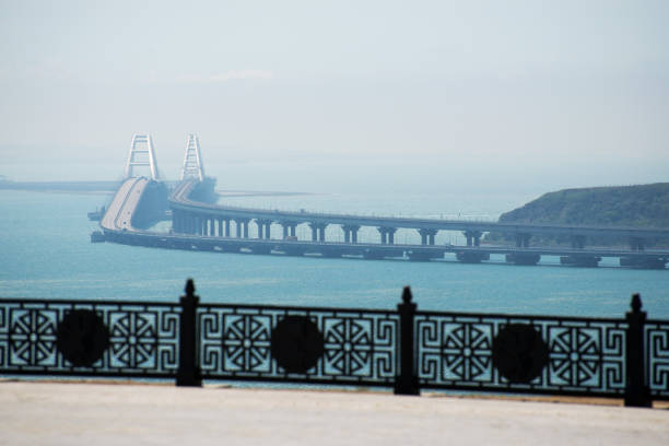 view of the crimean bridge and the sea from kerch - naval ship imagens e fotografias de stock