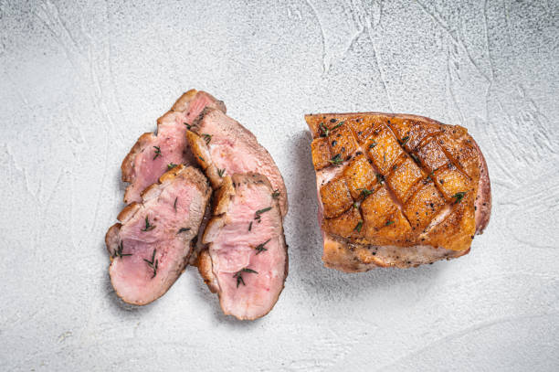 istock Roasted Sliced Duck breast fiilet steak. White background. Top view 1363599197