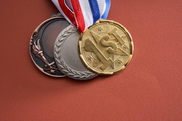 istock gold colored medal on red  background 1363600185