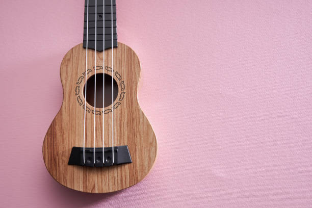 istock ukelele on pink color background 1363600262