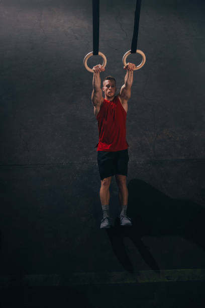 istock Handsome Man Exercising on Gymnastic Rings 1363602181
