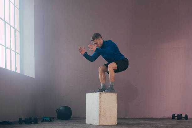 istock Serious Man Jumping in the Gym 1363602248