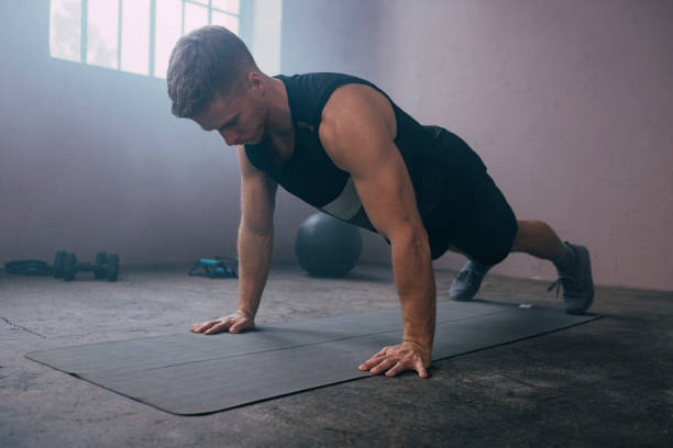 istock Serious Man Exercising in the Gym 1363602256