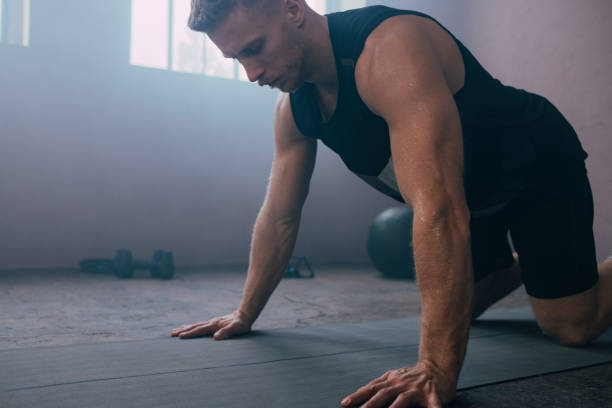 istock Serious Man Exercising in the Gym 1363602260