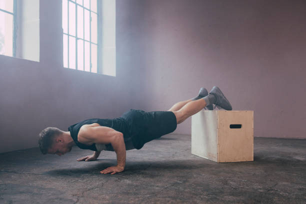 istock Serious Man Exercising in the Gym 1363602289