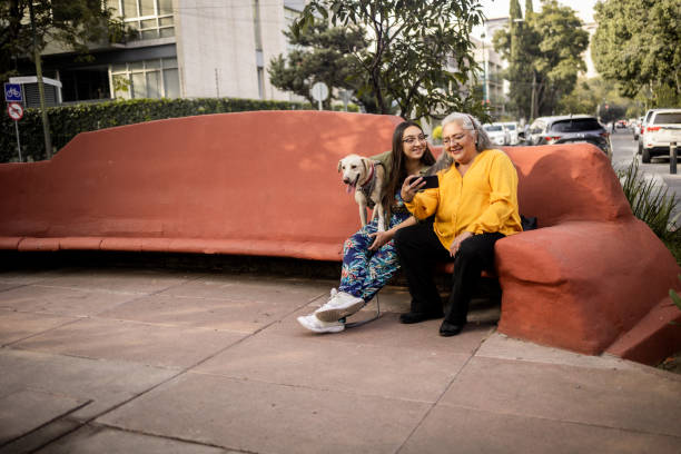 istock Mother and daughter sitting at the park 1363603197