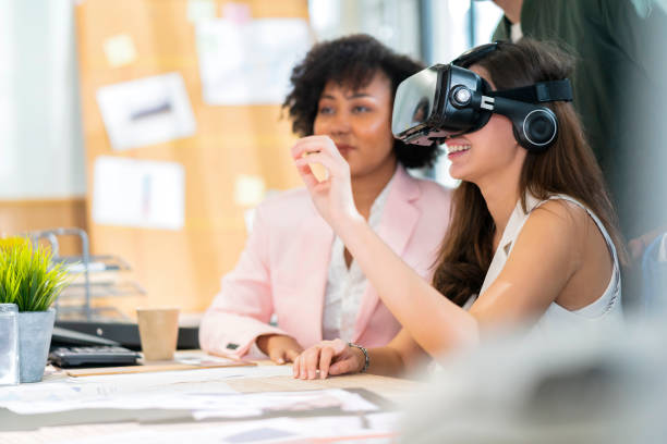 group of millennial male and female multiethnic using vr goggle to test metaverse meeting system cheerful and smiling,office friend standing discussion together next to window office background group of millennial male and female multiethnic using vr goggle to test metaverse meeting system cheerful and smiling,office friend standing discussion together next to window office background metaverse stock pictures, royalty-free photos & images