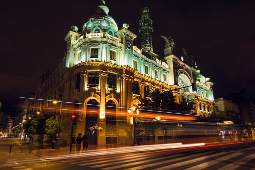 View of the facade of the post office building at night with lights trails. Valencia Spain.