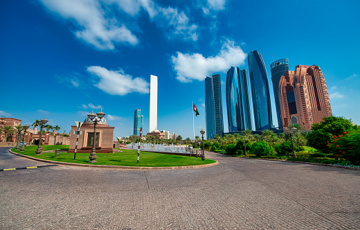 Buildings and skyscrapers of Abi Dhabi along Corniche Road on a sunny day, UAE