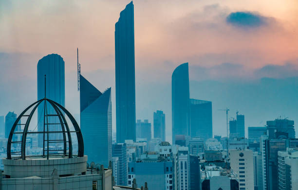 sunset aerial view of abu dhabi downtown skyline. - abu dhabi stok fotoğraflar ve resimler