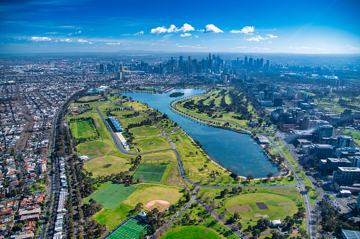 Melbourne, Australia. Aerial city skyline from helicopter. Skyscrapers, park and lake