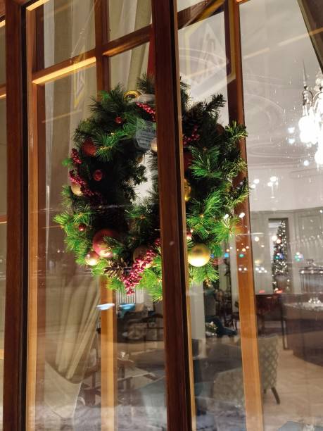 istock Christmas wreath in the window 1363608506